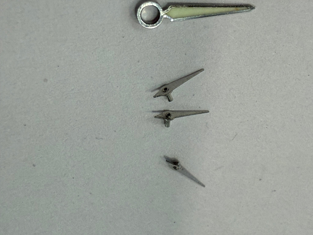 Original Zenith El Primero hands set for Caliber 400. All hands are in very good condition with no damage, except the central chronograph hand which has lost its silver plating. Fully original Zenith parts and a perfect fit for the same El Primero case an