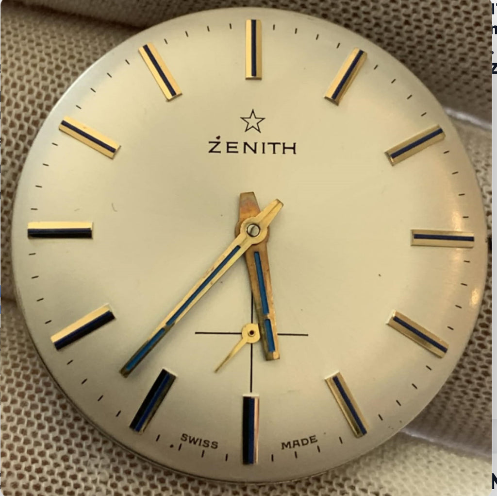 Brand: Zenith Caliber: 2541
Movement: Manual Wind
Jewels: 17 Jewels
Dial: Cream / beige dial with blue hour indicator ring Handes.