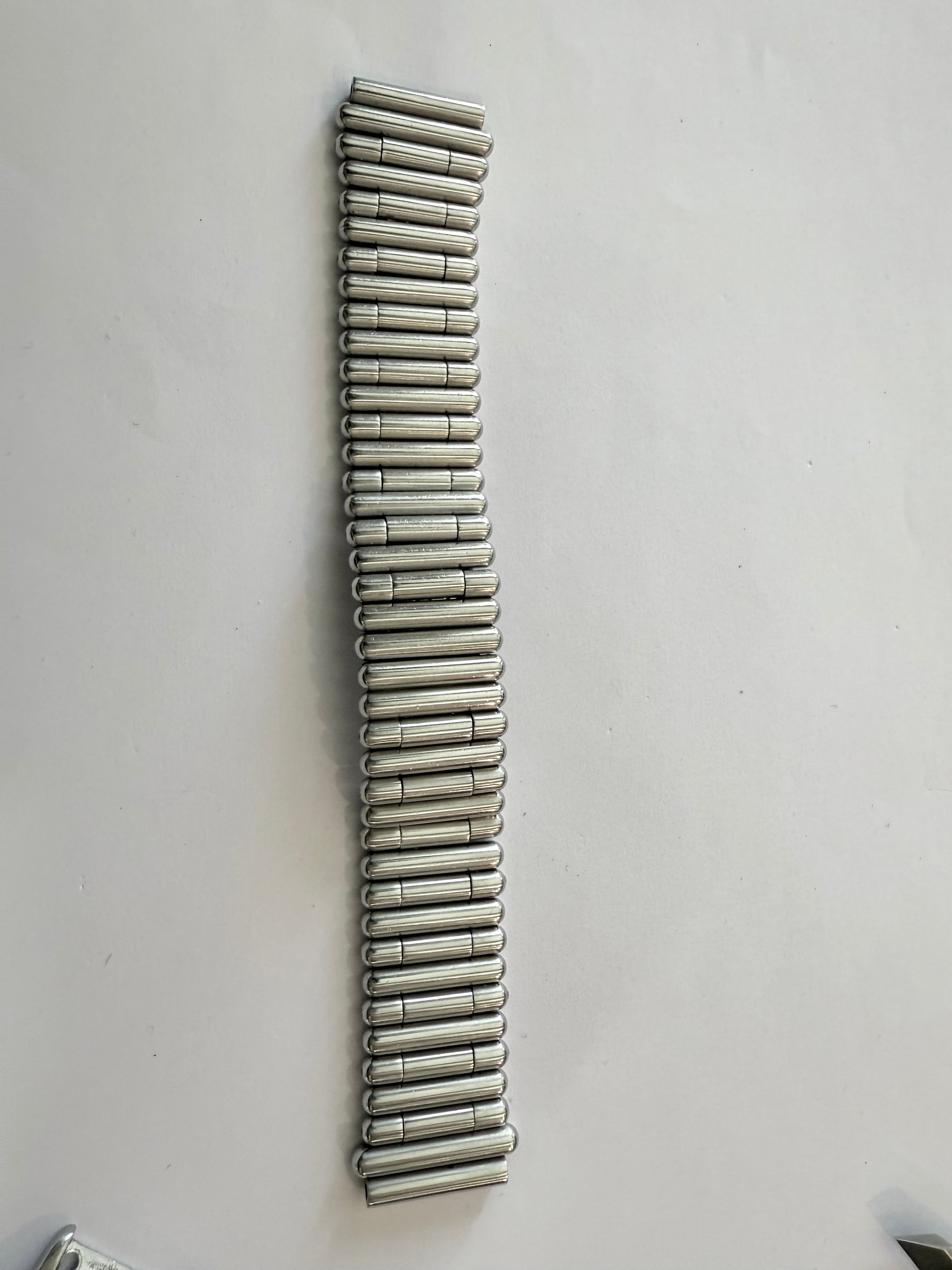 Breitling Rouleaux Bracelet 20mm Breitling Rouleaux (Bullet-Style) width, with authentic Breitling logo visible under magnification. Excellent condition and fully genuine.