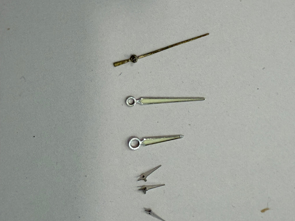 Original Zenith El Primero hands set for Caliber 400. All hands are in very good condition with no damage, except the central chronograph hand which has lost its silver plating. Fully original Zenith parts and a perfect fit for the same El Primero case an